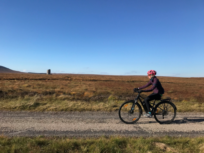 CycleForNature - Francesca passes by the Flows Lookout at Forsinard Flows NNR.
