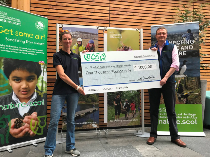 CycleForNature presents a donation to Scottish Association of Mental health.