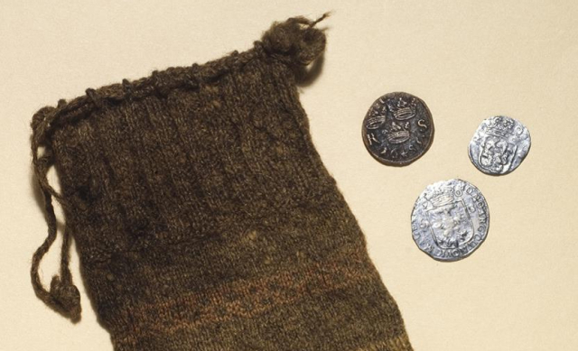 The unique knitted purse and the coins found on Gunnister Man.  Photo credit: National Museums Scotland.