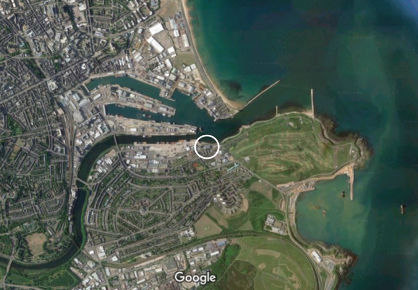 Aerial photograph of Aberdeen harbour with the office location marked.