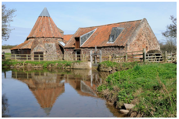 Preston Mill building surrounded by water