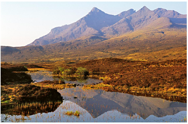 Lochan and moorland  with the sharp peaks of Sgurrnan Gilean and the Black Cuillin Ridge rising steeply behind