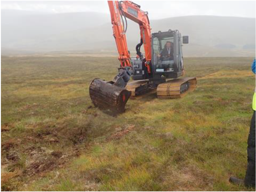 Low ground pressure excavator digging on land