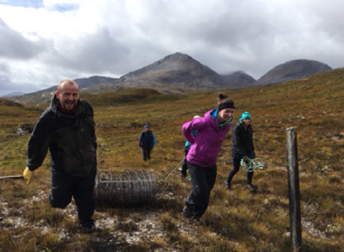 five volunteers removing the Beinn Eighe ring-fence