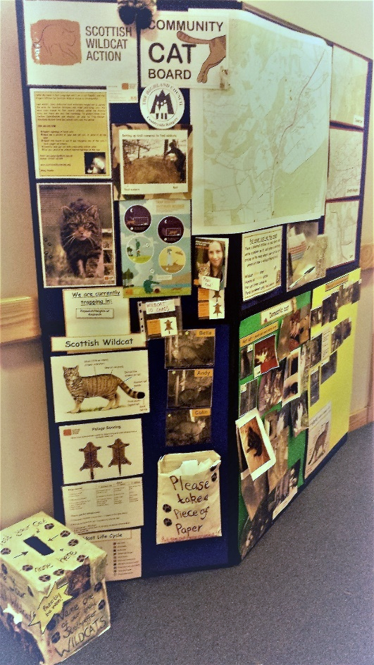 A photo pf a display board set up in a community centre.