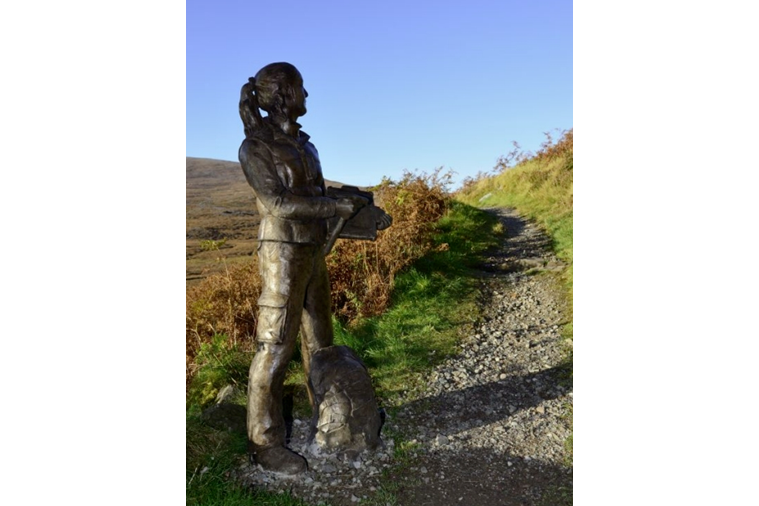 Statue at the side of a path at Knockan Crag NNR