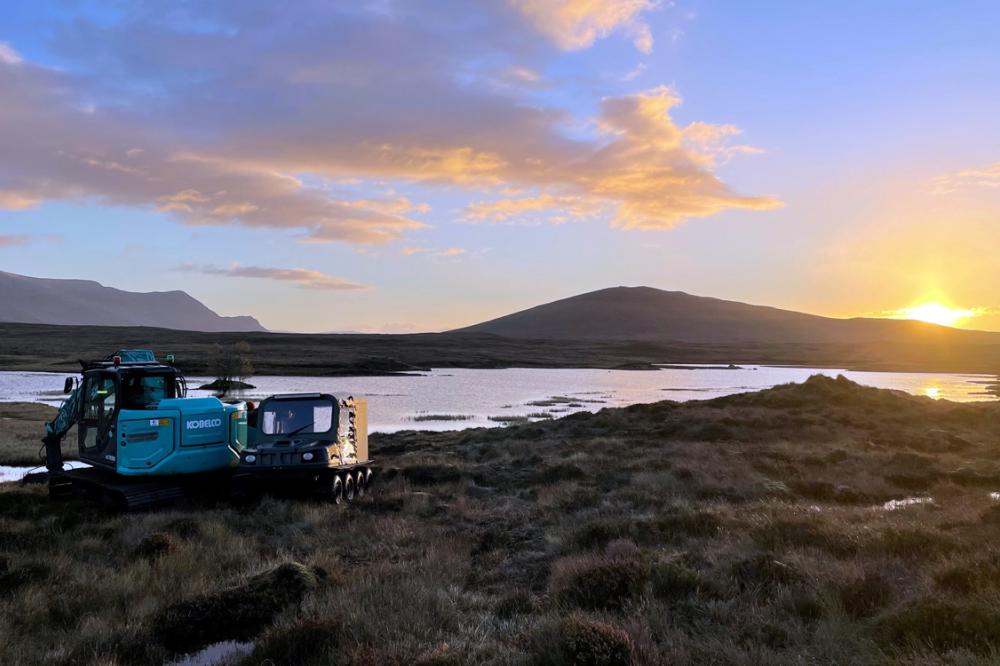 Restoration machinery on peatland with river in the background