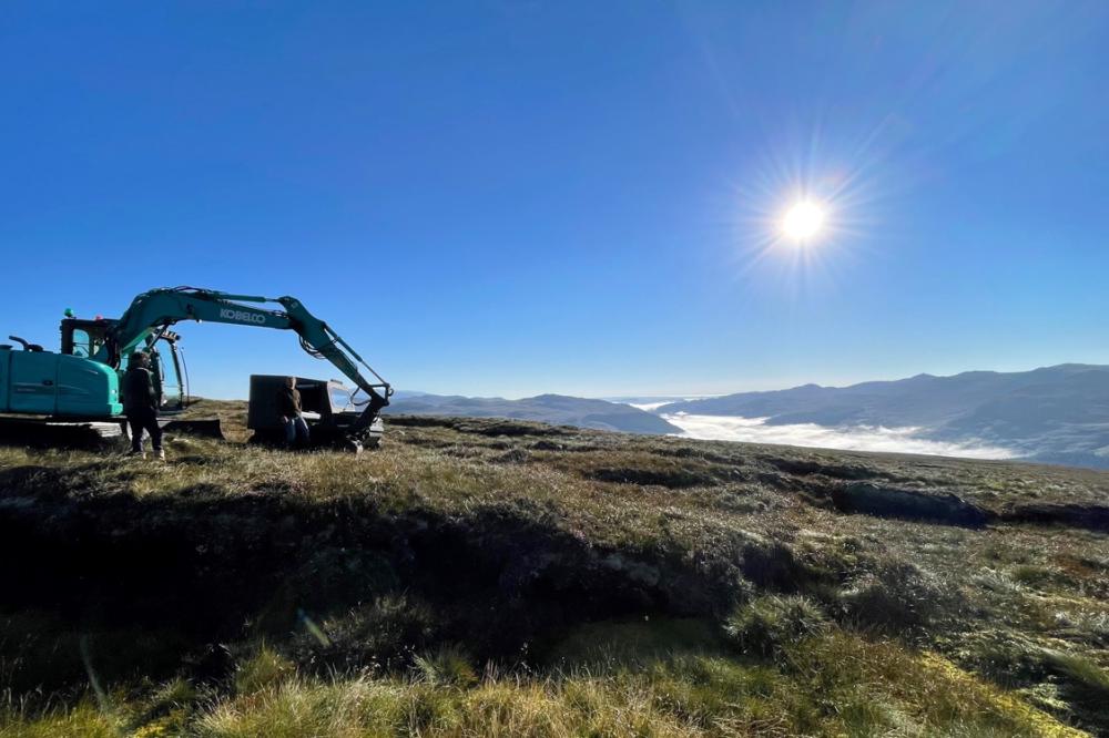 A digger on a hill