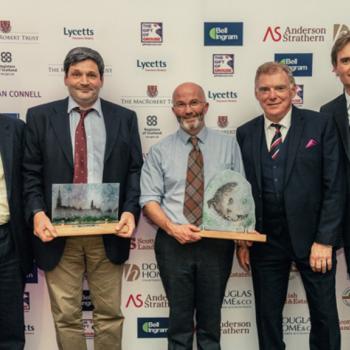 Group photo of Dryhope Farm holding Scottish Land and Estate's Helping it Happen Awards winners trophy for the 'Enhancing our Environment' category (2018)