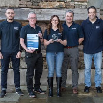 Group photo of Scottish Water's Sustainable Land Management Team holding Shetland Environmental Awards (2017) winners trophy for NatureScot and SW Peatland ACTION funded restoration work at Sandy Loch.