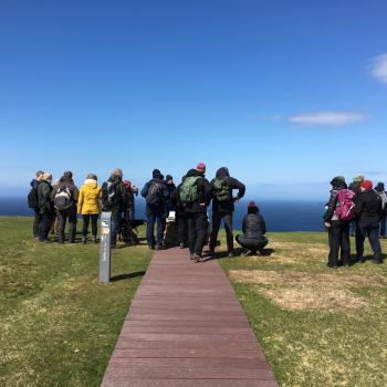 Hermaness Hill Path, a group of people at the interpretation cairn.