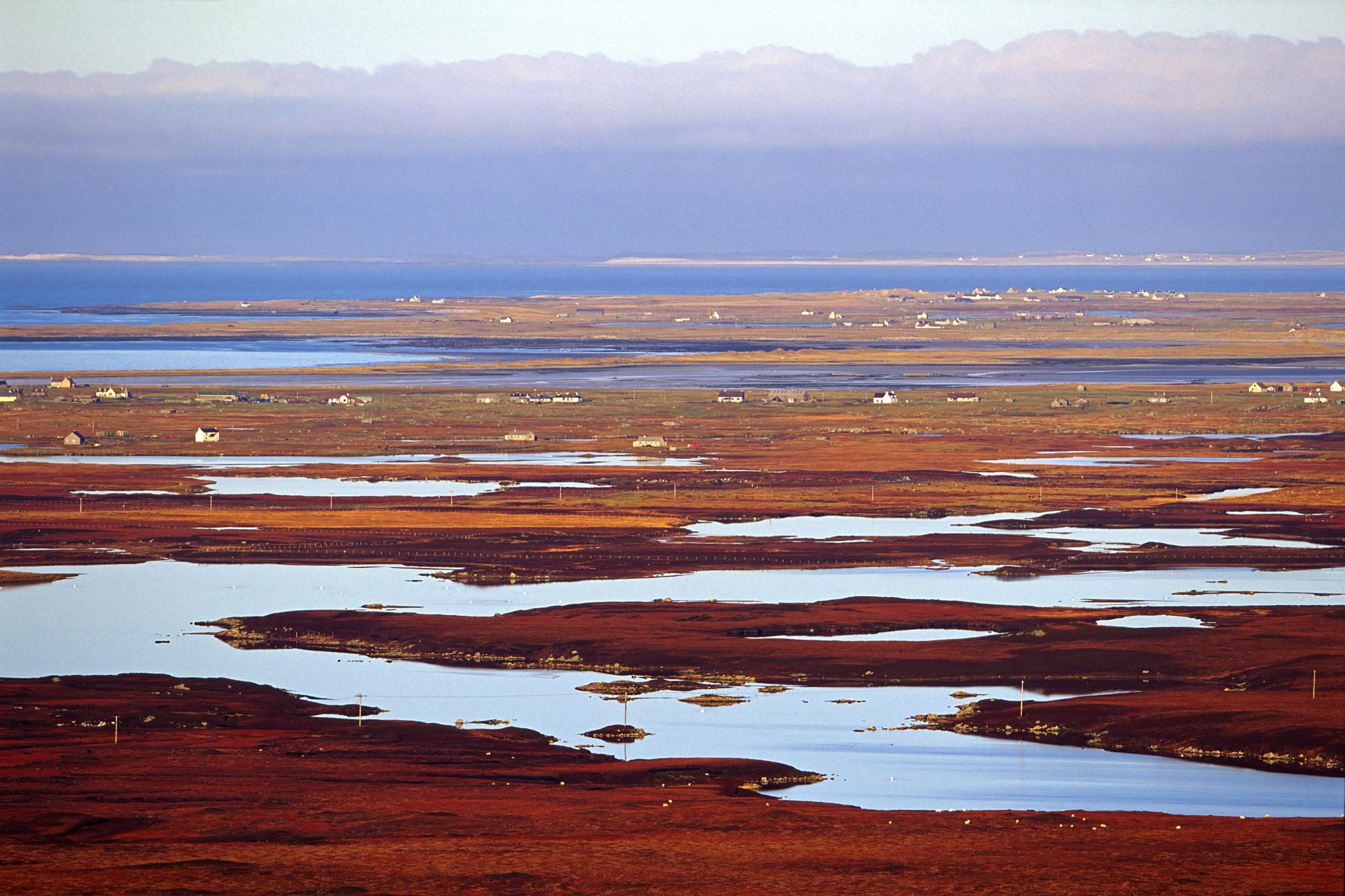View north west across the peatland lochs and machair of South Uist and Benbecula ©Lorne Gill/SNH. For information on reproduction rights contact the Scottish Natural Heritage Image Library on Tel. 01738 444177 or www.nature.scot